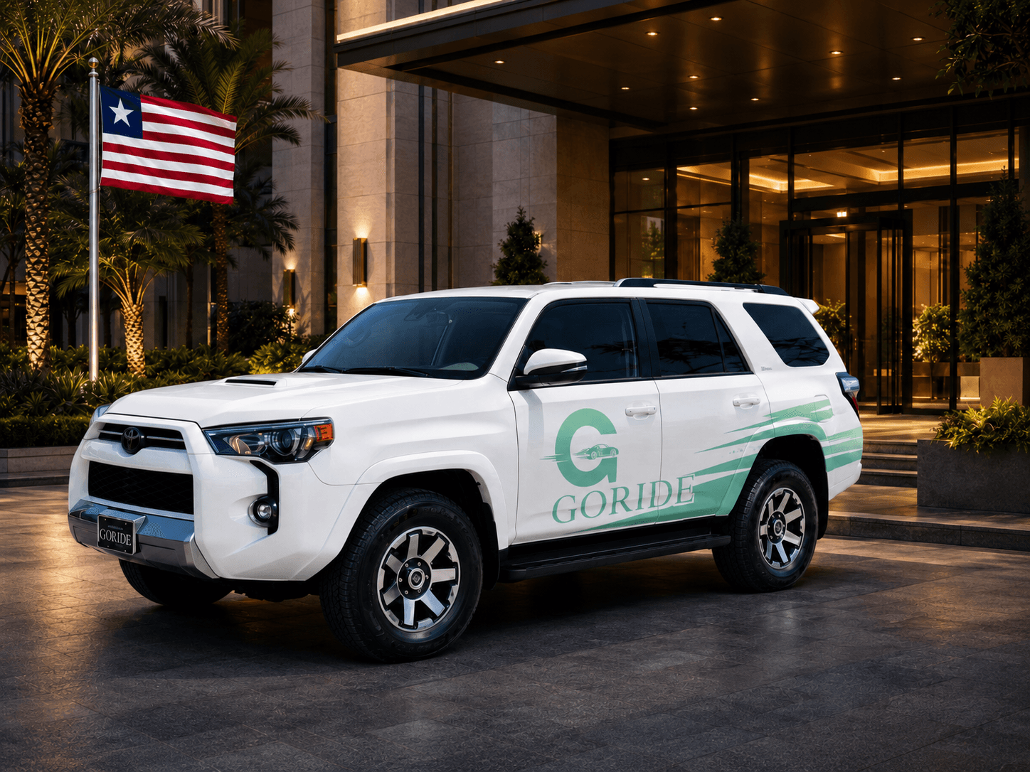 GoRide branded SUV outside a premium entrance with Liberia flag